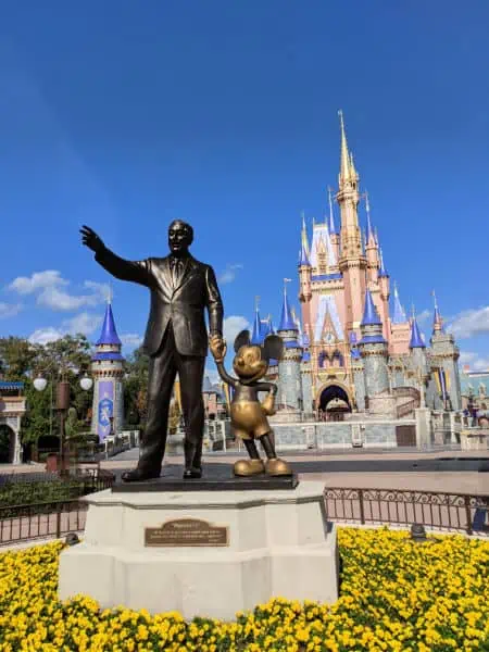 Walt Disney and Mickey Statue with Cinderella's Castle in the background at Magic Kingdom