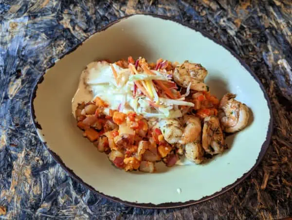 Chili Garlic Shrimp Bowl with red and sweet potato base and creamy herb dressing at Satu'li Canteen
