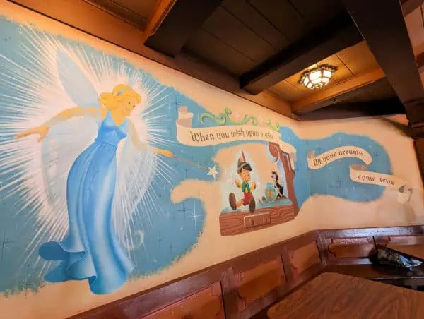 Mural of Pinocchio and the Blue Fairy at Pinocchio Village Haus in Disney World's Magic Kingdom