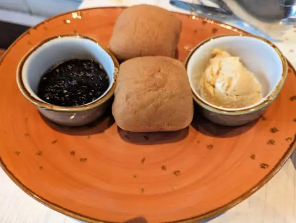 Gluten free dinner rolls with guava butter and onion jam at Sebastian's Bistro.